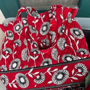 red and white flowered Vera Bradley bag with a cosmetic bag